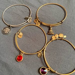 Lot of 4 alex and ani bracelets. 3 gold tone and 1 silver tone